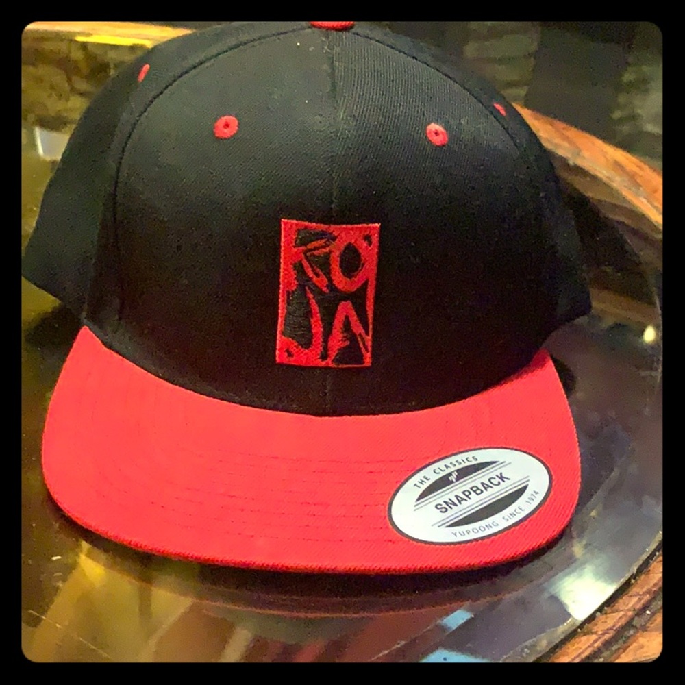 Black and red yupoong snap back hat